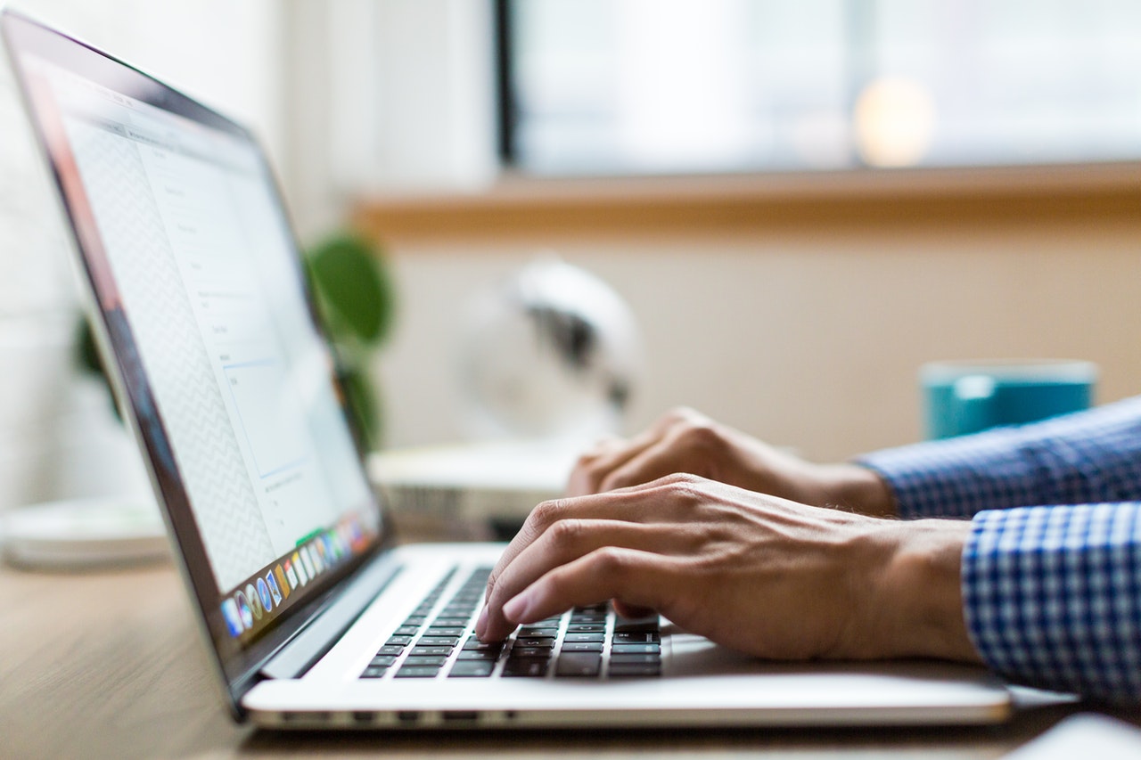 person using Macbook